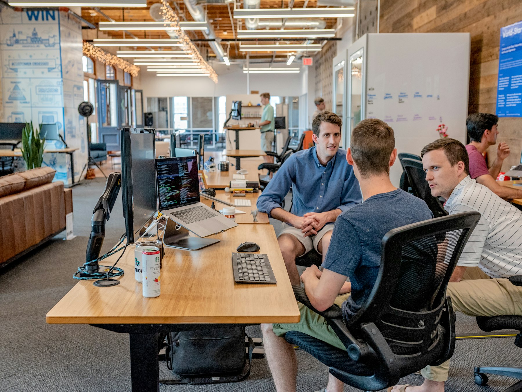 Team collaborating in a busy modern office