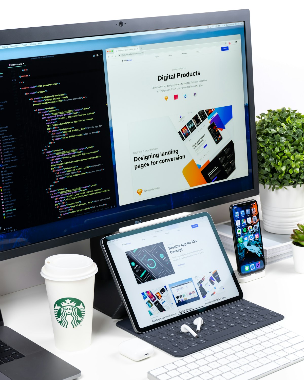 Web design workspace with laptop and sketches